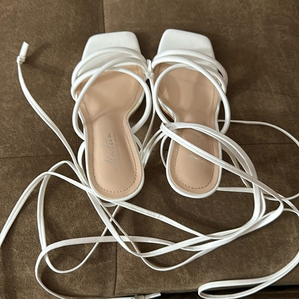 White heels with ties around the ankle